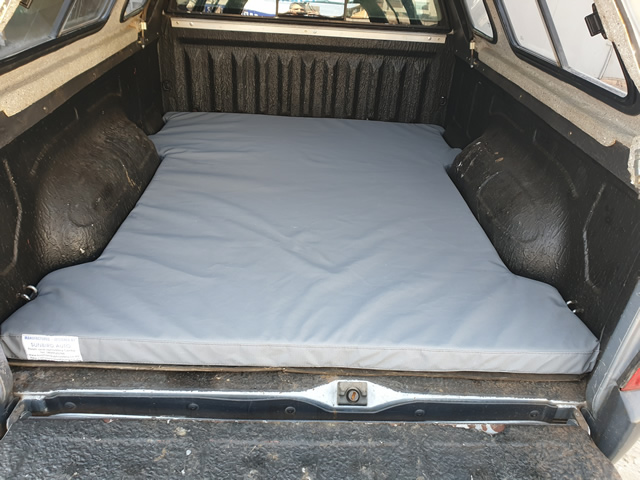 Bakkie Mattress in Canopy Grey custom bakkie mattress fitted in a bakkie load bin under a canopy